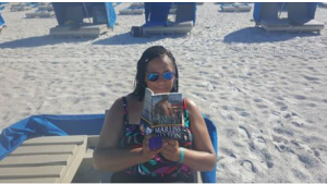 Melanie reading Marliss Melton novel